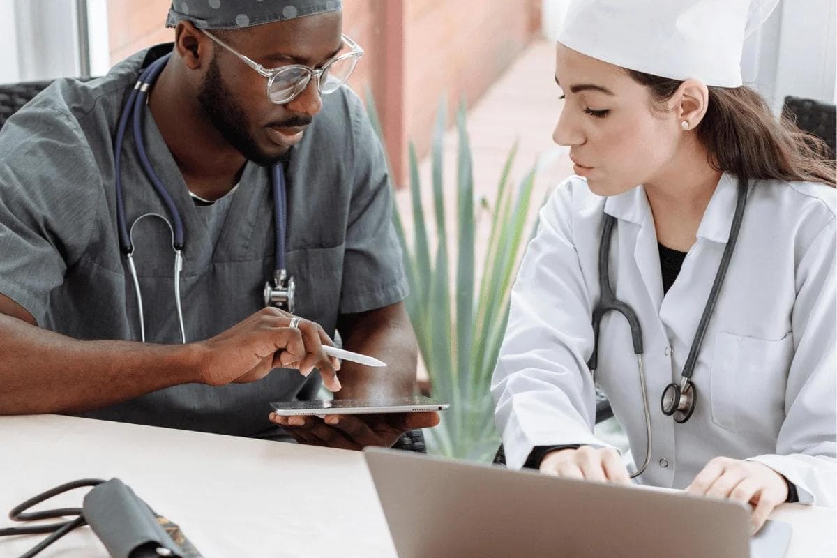 Doctors collaborating during medical consultation at a clinic.